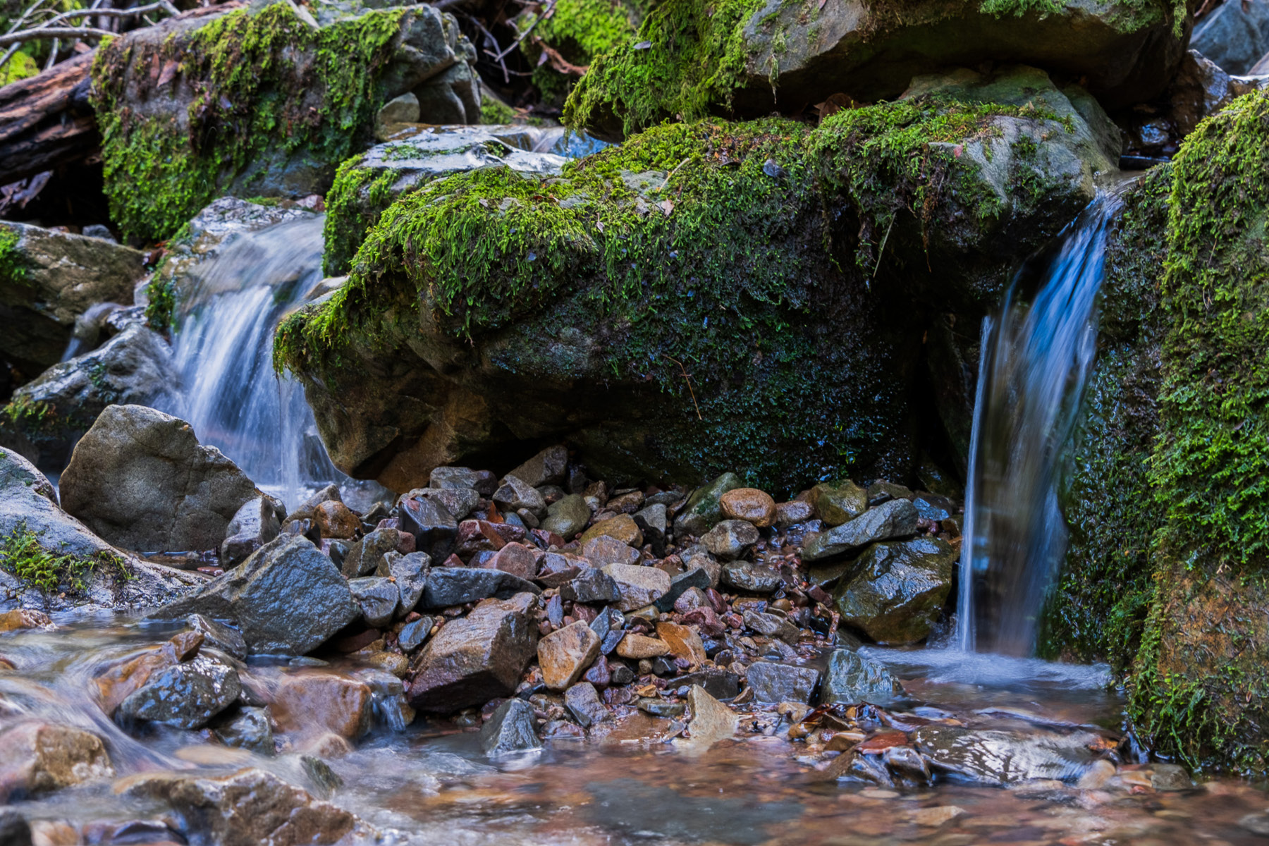Water streaming over large rocks