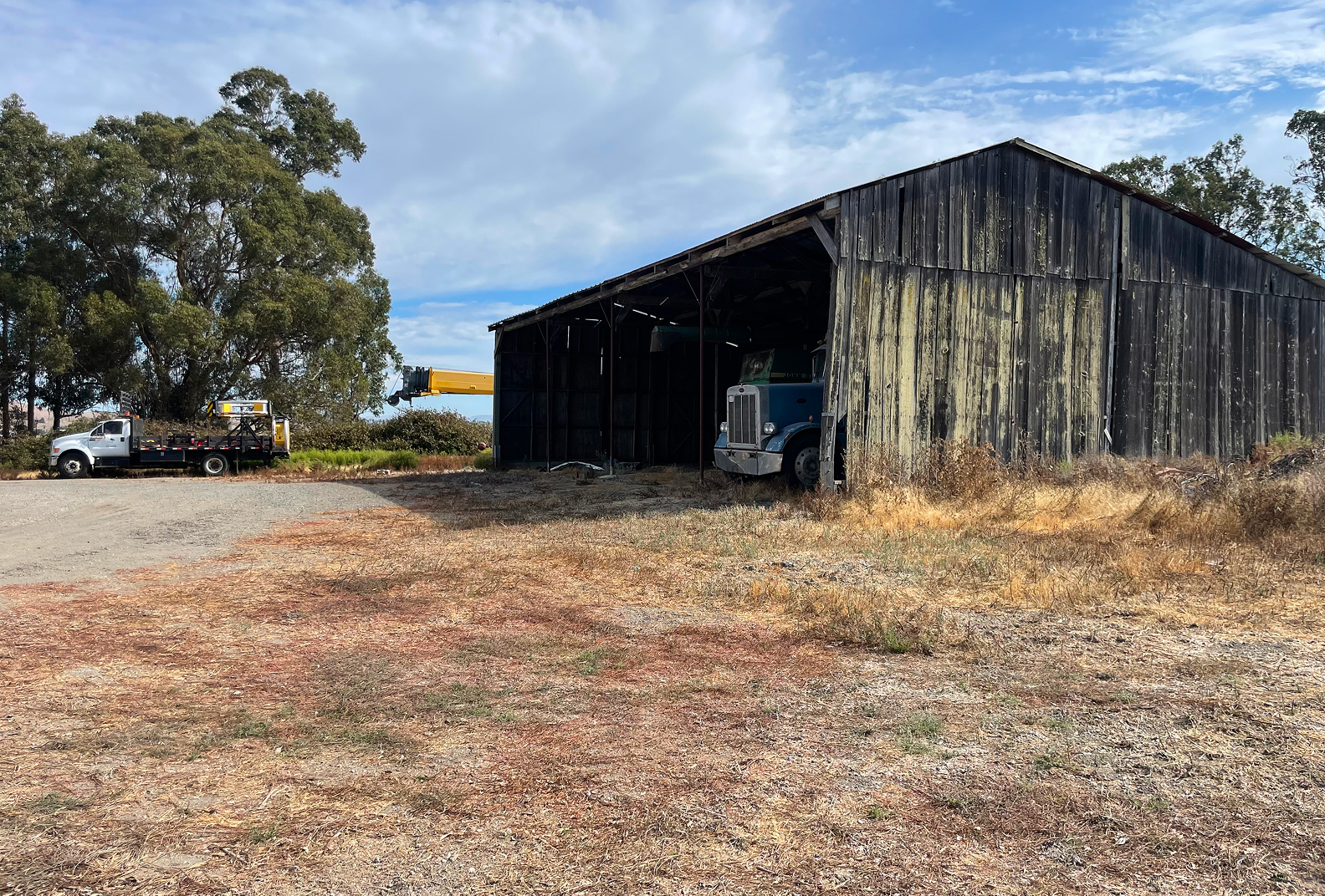 Weathered barn under blue skies