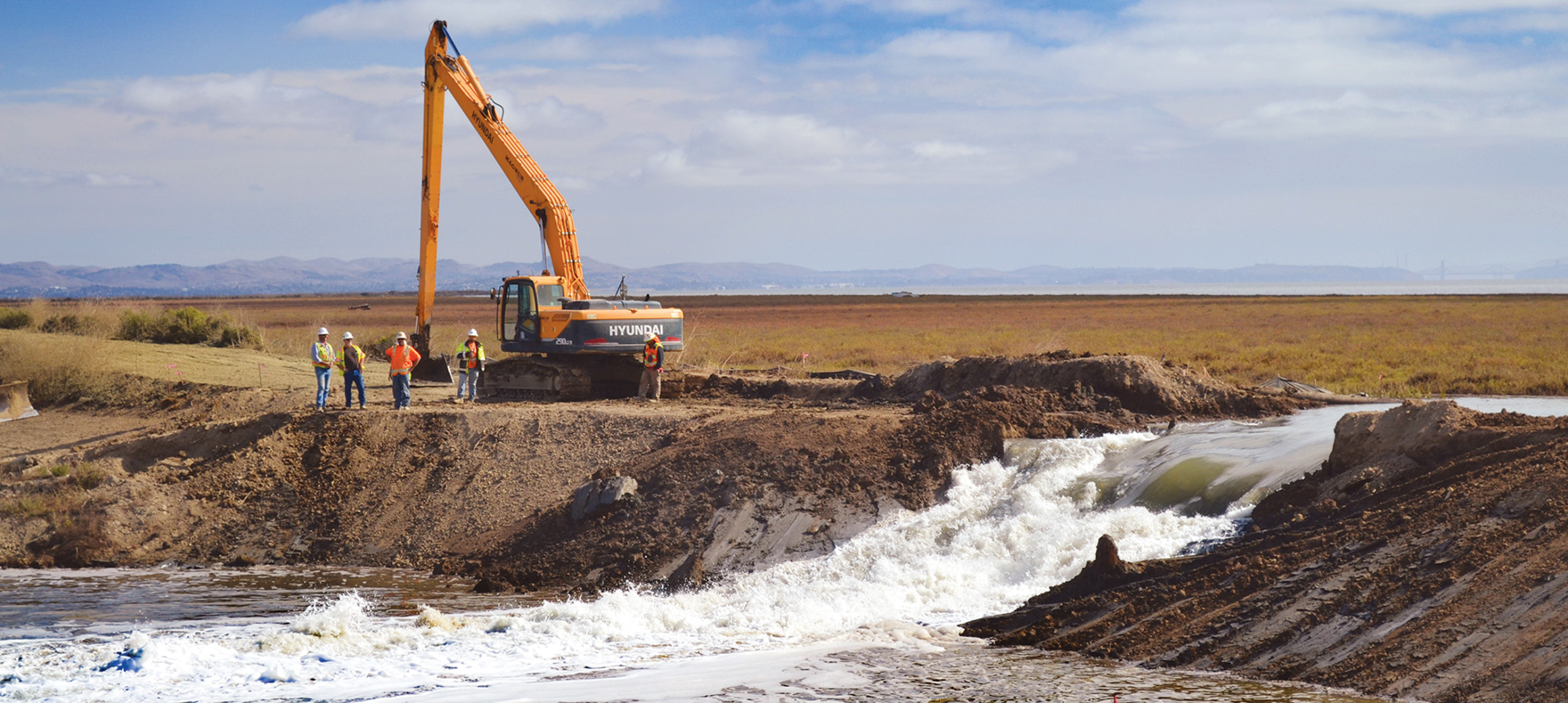 Water flowing through levee breach at Sears Point