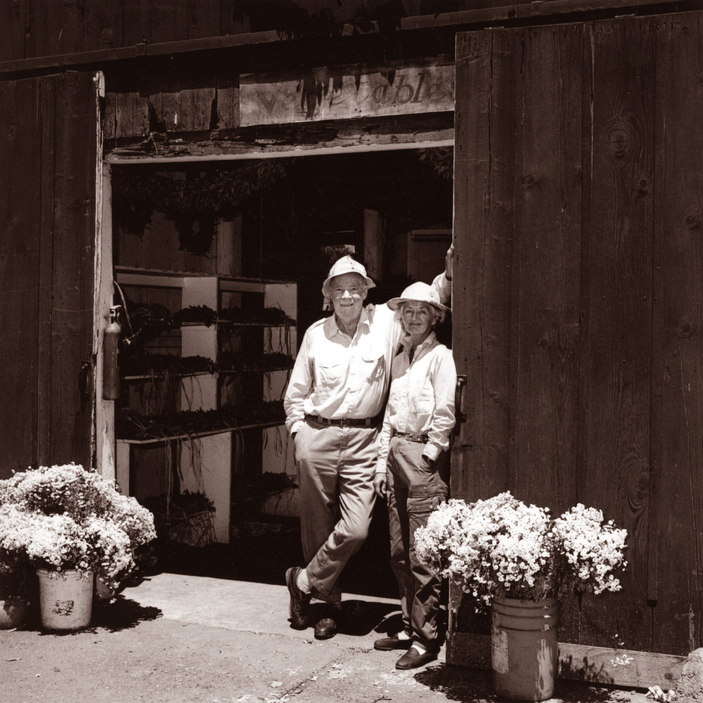 Otto and Anne Teller in black and white photo in front of barn