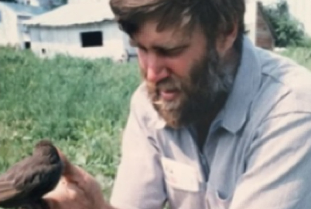 Bob Thieriot with a bird in his hands.