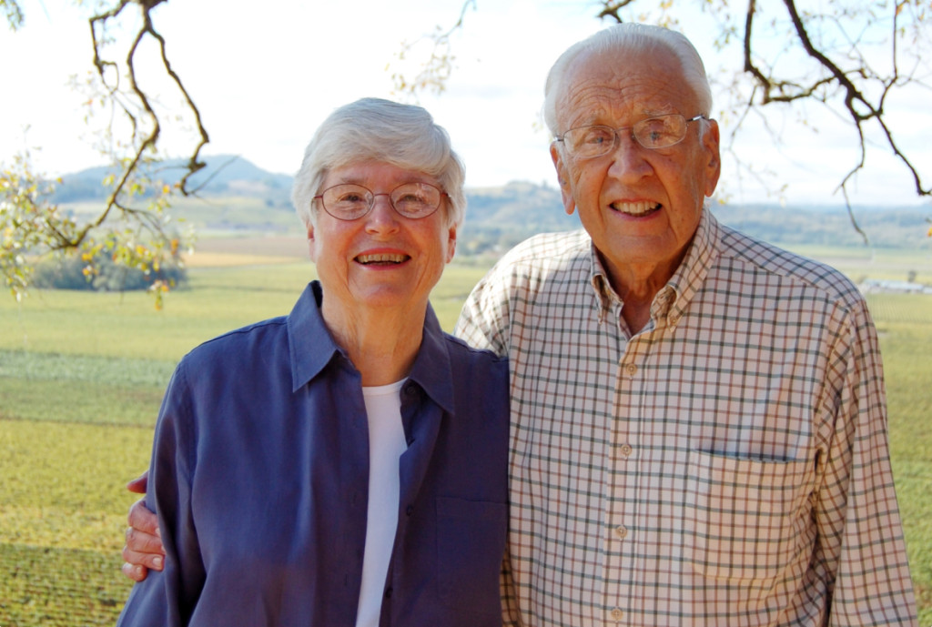 Mary and Dick Hafner standing by a tree.