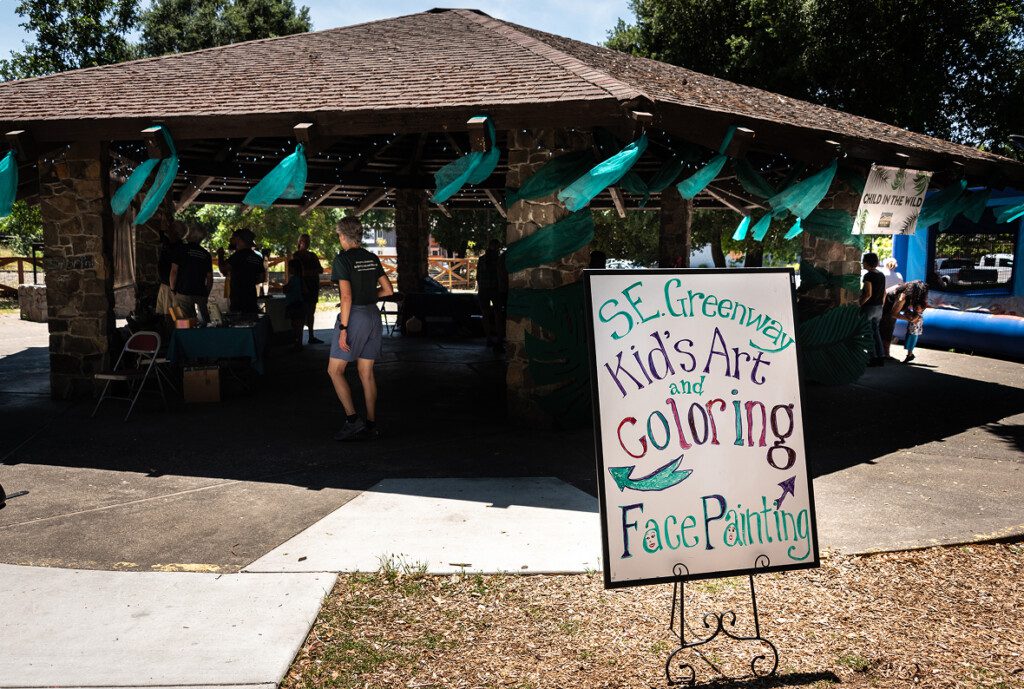 Face painting sign at Child in the Wild event.