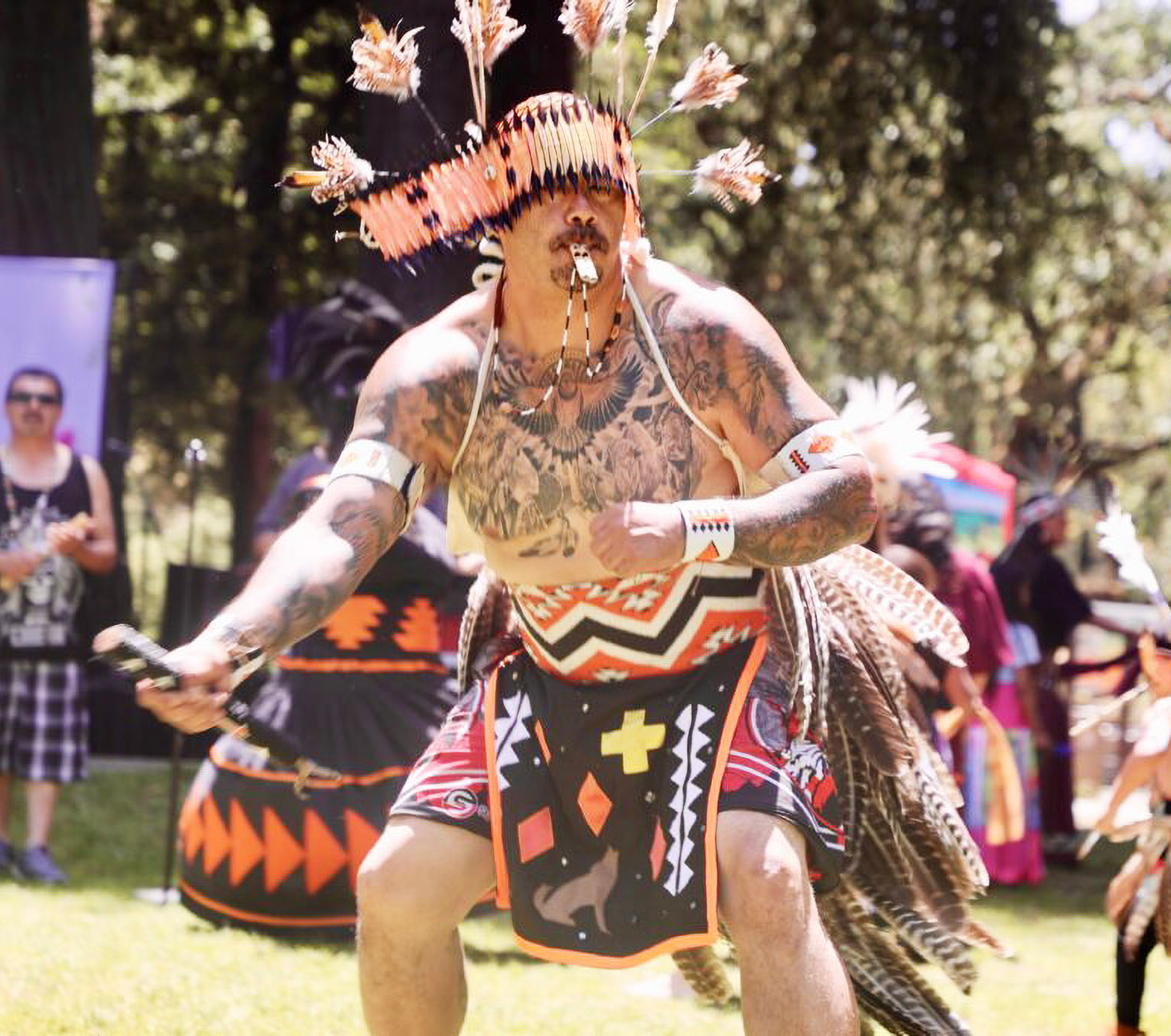 Pomo dancer performing at an event.