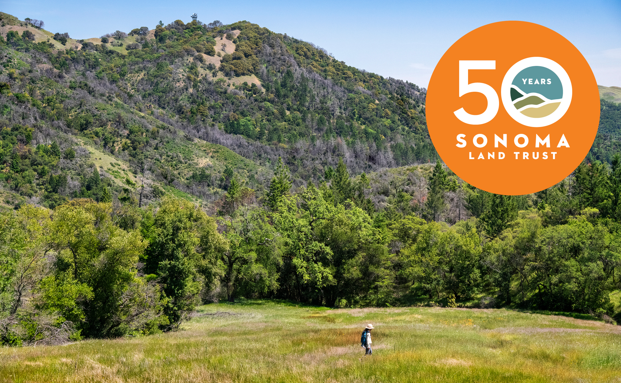 Scenic view of Fitzsimmons Ranch with Sonoma Land Trust 50th logo.